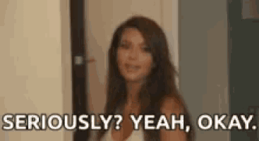 a woman is standing in a doorway and says `` seriously ? yeah , okay . ''