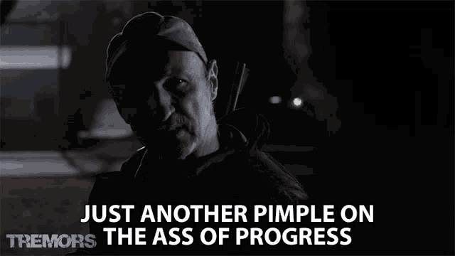 a man says just another pimple on the ass of progress while holding a gun