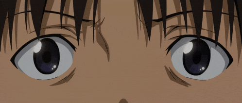 a close up of a person 's eyes with a very dark background