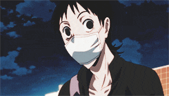 a cartoon character wearing a white face mask looks at the camera