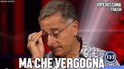 a man wearing glasses and a ring wipes his forehead in front of a screen that says viperissima trash 132