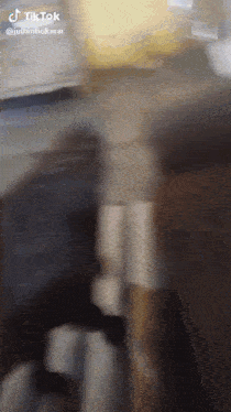 a blurred image of a person 's face with a tiktok watermark
