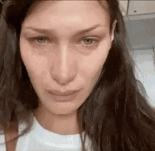 a close up of a woman 's face with long hair .