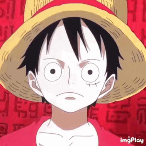 a close up of monkey d luffy from one piece wearing a straw hat and a red shirt .