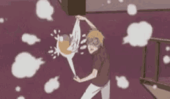 a man is holding a badminton racket in his hand while standing in a room .