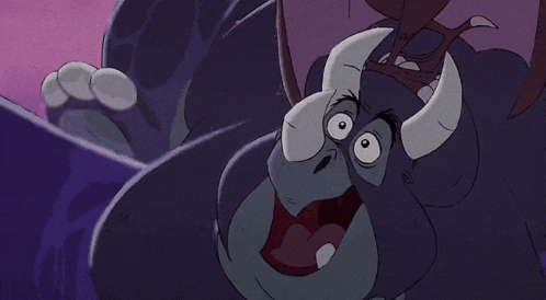 a close up of a cartoon character with horns making a funny face