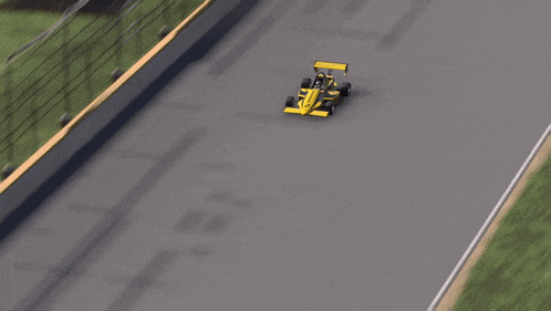a yellow race car with the number 11 on the side