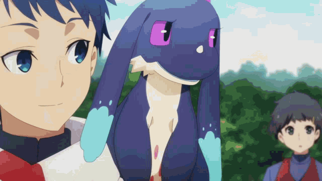 a boy is holding a stuffed animal with a purple eye