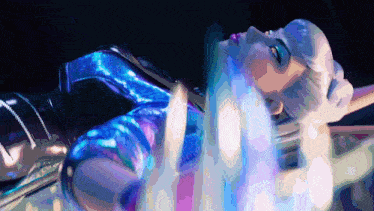 a woman in a blue and purple outfit is laying on her back