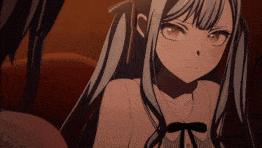 a close up of a girl with pigtails and a black bow