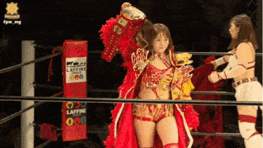 a woman in a wrestling ring holding a trophy that says laffine
