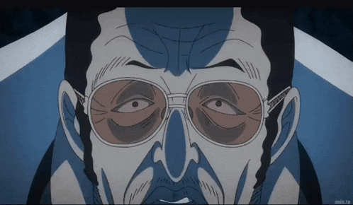 a close up of a man 's face with anime.tv written below it