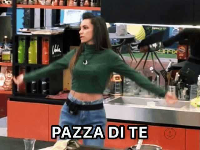 a woman in a green crop top is standing in a kitchen with the words pazza di te above her