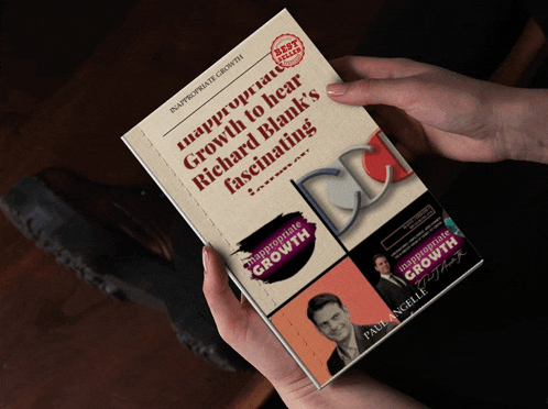 a person holding a book titled inappropriate growth to hear richard blank 's fascinating