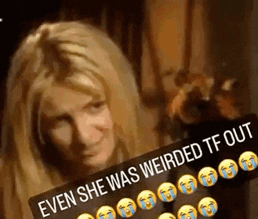 a woman is holding a sign that says `` even she was weird tf out '' .