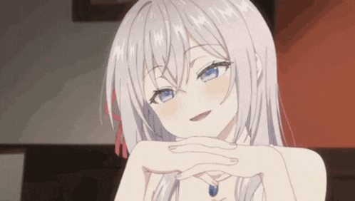 a girl with white hair and blue eyes is smiling with her hands on her face .