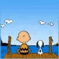 charlie brown and snoopy are sitting on a dock overlooking the ocean .