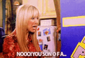 a woman is sitting in front of a refrigerator and says nooo ! you son of a .