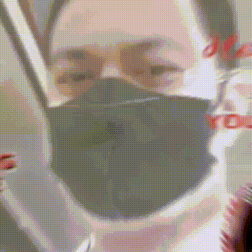 a close up of a person wearing a mask and glasses .