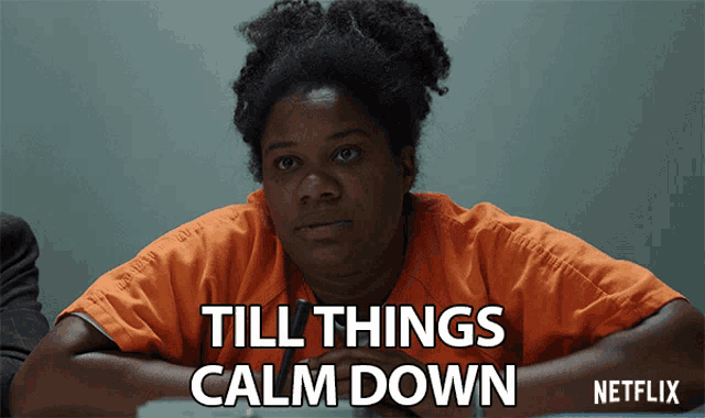 a woman in a jail cell with the words till things calm down
