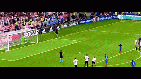 a soccer game is being played on a field with advertisements for mcdonald 's and adidas