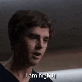 a man is talking and saying `` i am high iq '' in a dark room .