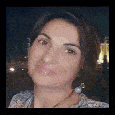 a woman 's face is shown in a pixelated image