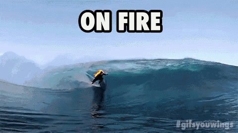 a surfer is riding a wave with the words " on fire " above him