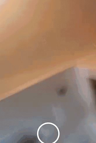 a close up of a person 's face with a circle in the middle