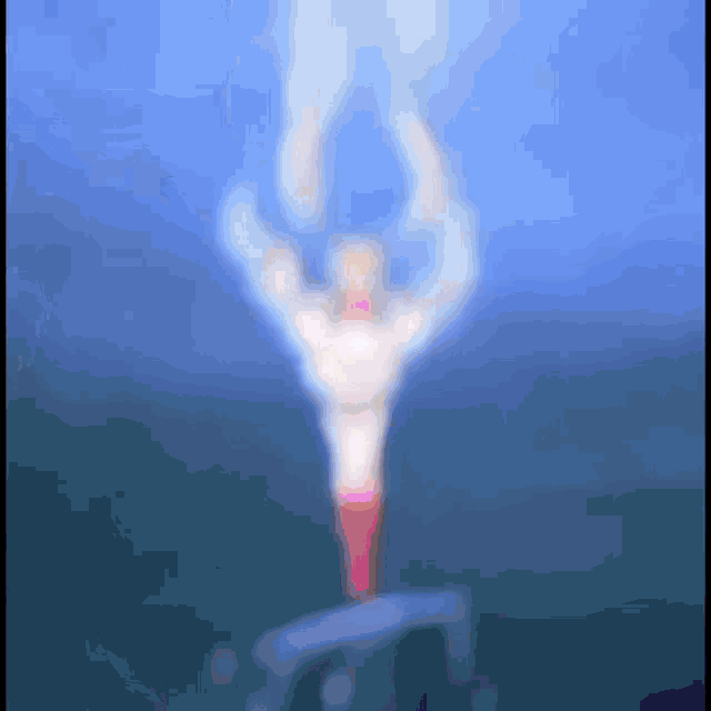 a blurred image of a person in a red and white outfit