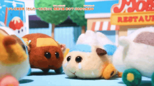 a group of stuffed animals are standing in front of a moose restaurant