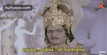 a man is wearing a crown and a mustache and says ayyare brama idi ma brama