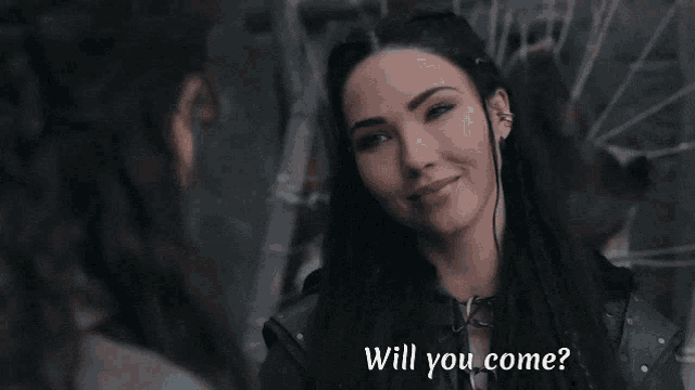 a woman looking at another woman with the words will you come below her