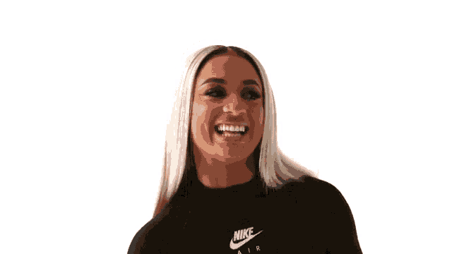 a woman wearing a black nike air shirt is making a face .