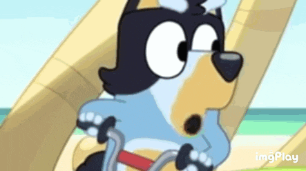 a cartoon dog is riding a bicycle on the beach .