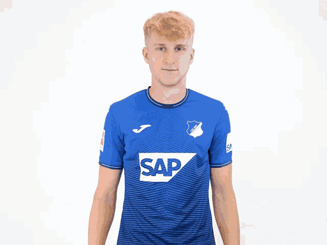 a man wearing a blue shirt with the word sap on the front