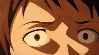 a close up of a person 's face with a surprised expression