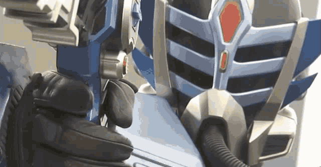 a close up of a robot with a red arrow pointing to the right