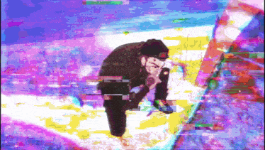 a colorful image of a man kneeling down with a microphone