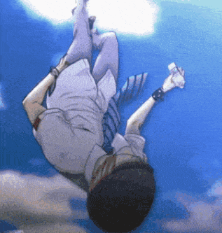a man in a suit and tie is falling upside down in the air