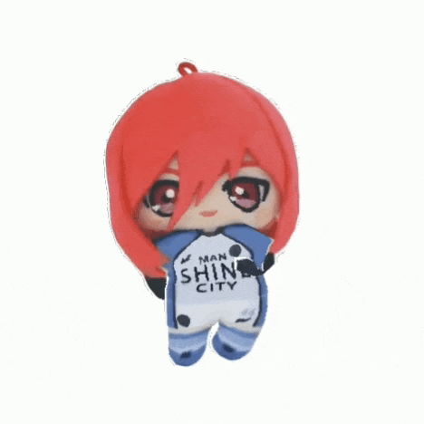 a stuffed doll with red hair and a man shine city jersey