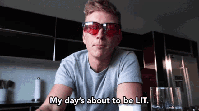 a man wearing red sunglasses says my day 's about to be lit.