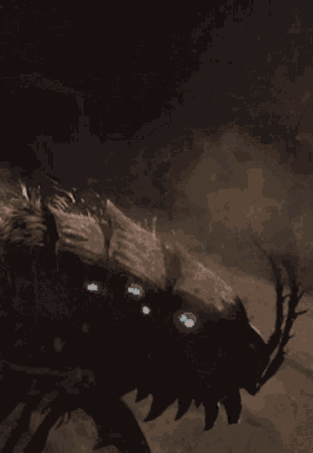 a painting of a monster with glowing blue eyes