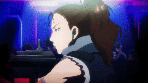 a woman in a ponytail is holding a gun in her hand .