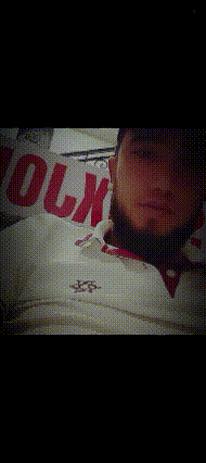 a man is wearing a white shirt with the word olm on the front