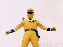 a blue power ranger is holding a sword in his right hand