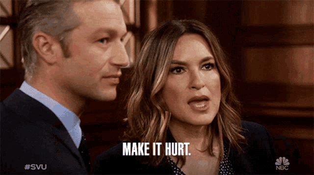 a man and woman are looking at each other and the woman is saying make it hurt