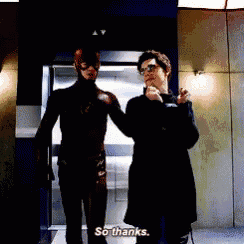 a man in a superhero costume is standing next to another man and says so thanks .