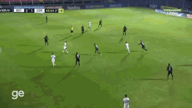 a soccer game is being played on a field sponsored by premiere and bodog