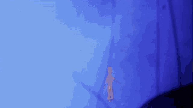a blue background with a silhouette of a person in the corner